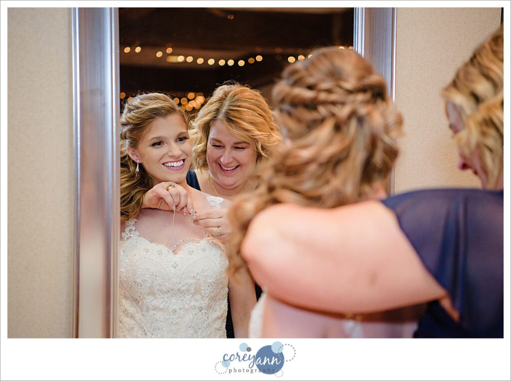 Bride getting ready for wedding at Roses Run Country Club