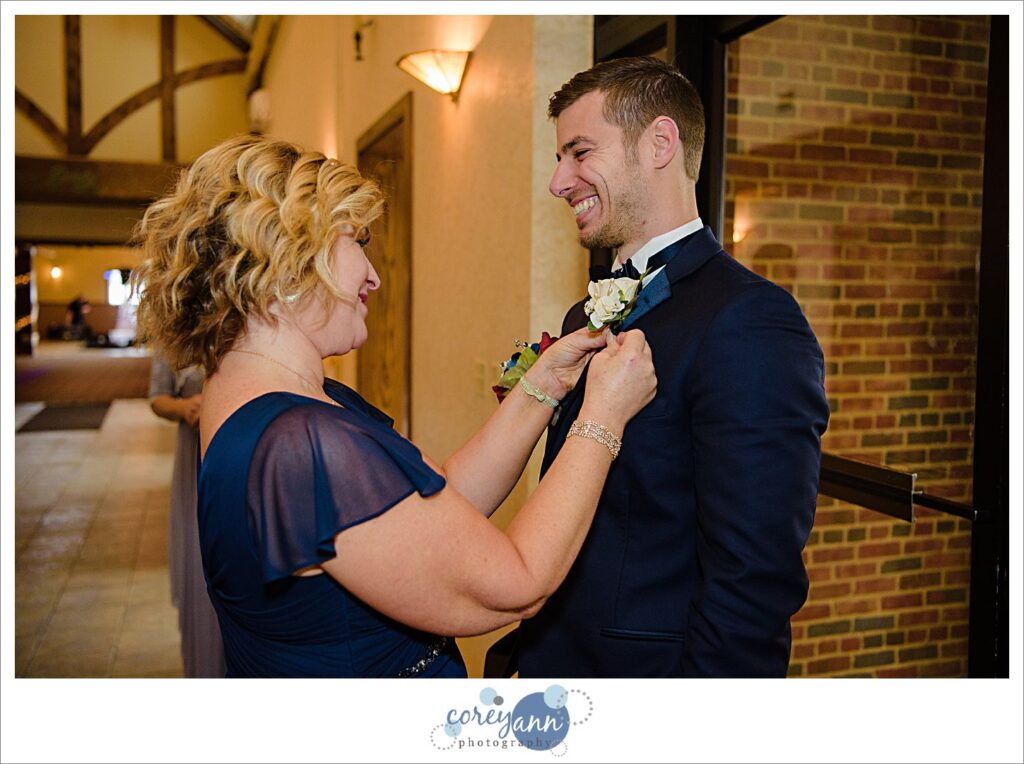 Groom getting ready for wedding at Roses Run Country Club