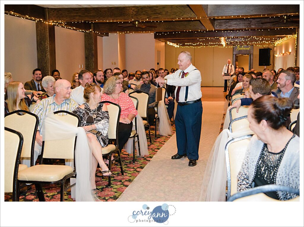 Grandfather ring bearer at wedding ceremony at Roses Run