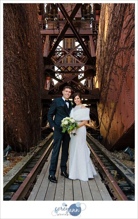 bride and groom at iron bridge in Cleveland Flats
