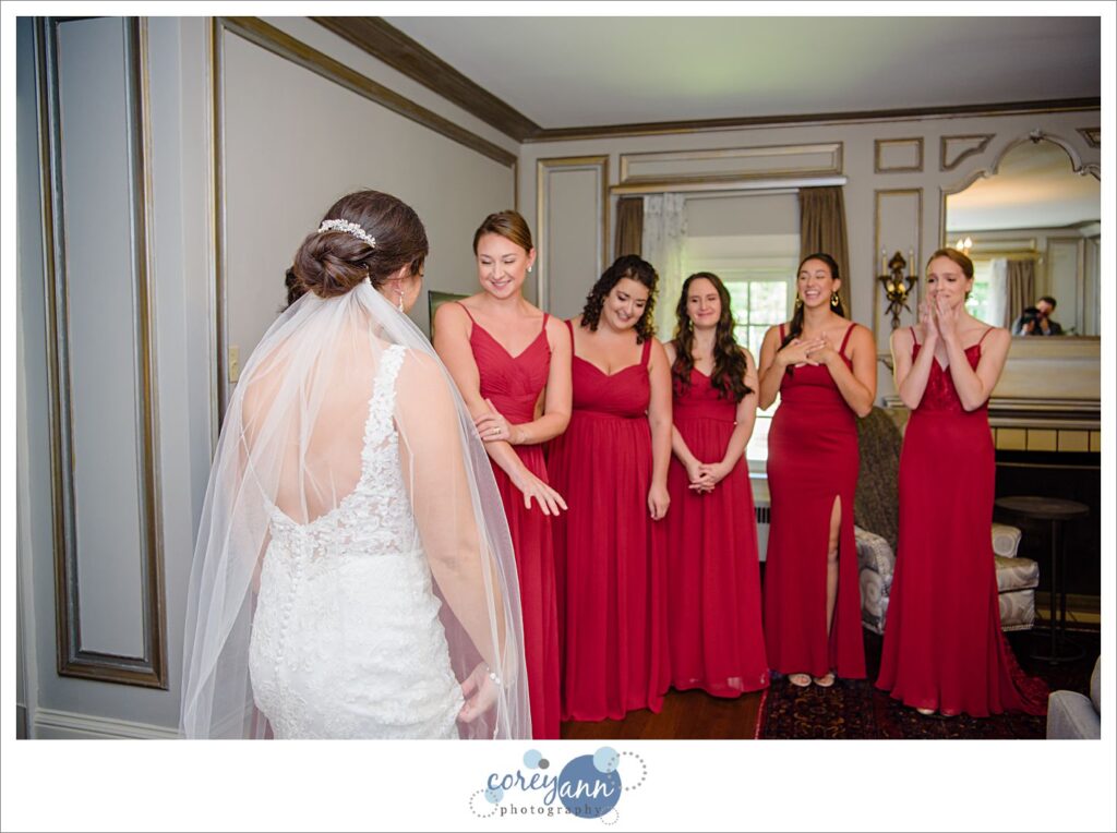 Bridesmaid first look at bride in Akron