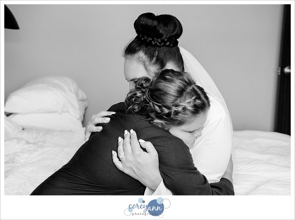 bride and daughter hug before wedding in Northeast Ohio
