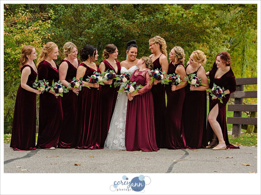 Bridesmaids in red velvet gowns