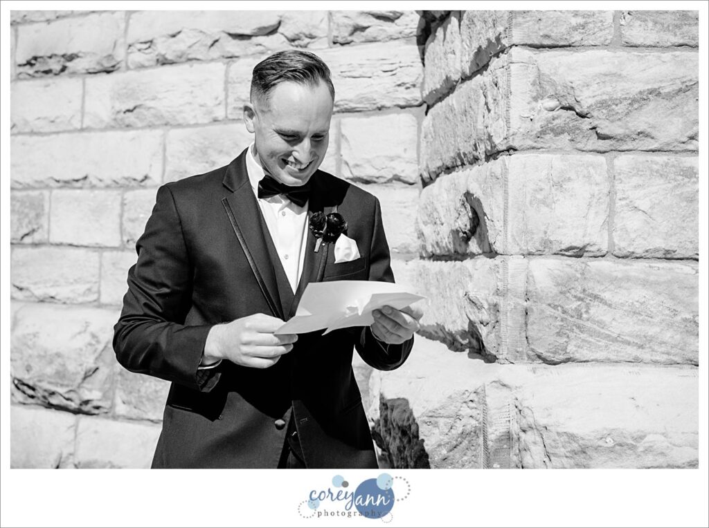 groom reading letter from bride