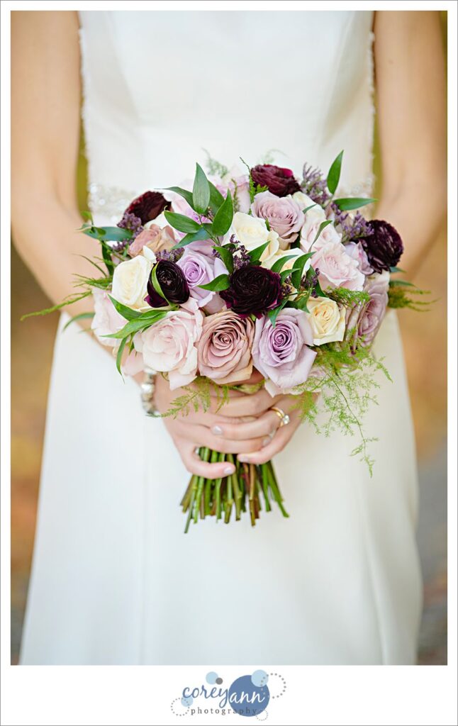 Purple themed rose bridal bouquet