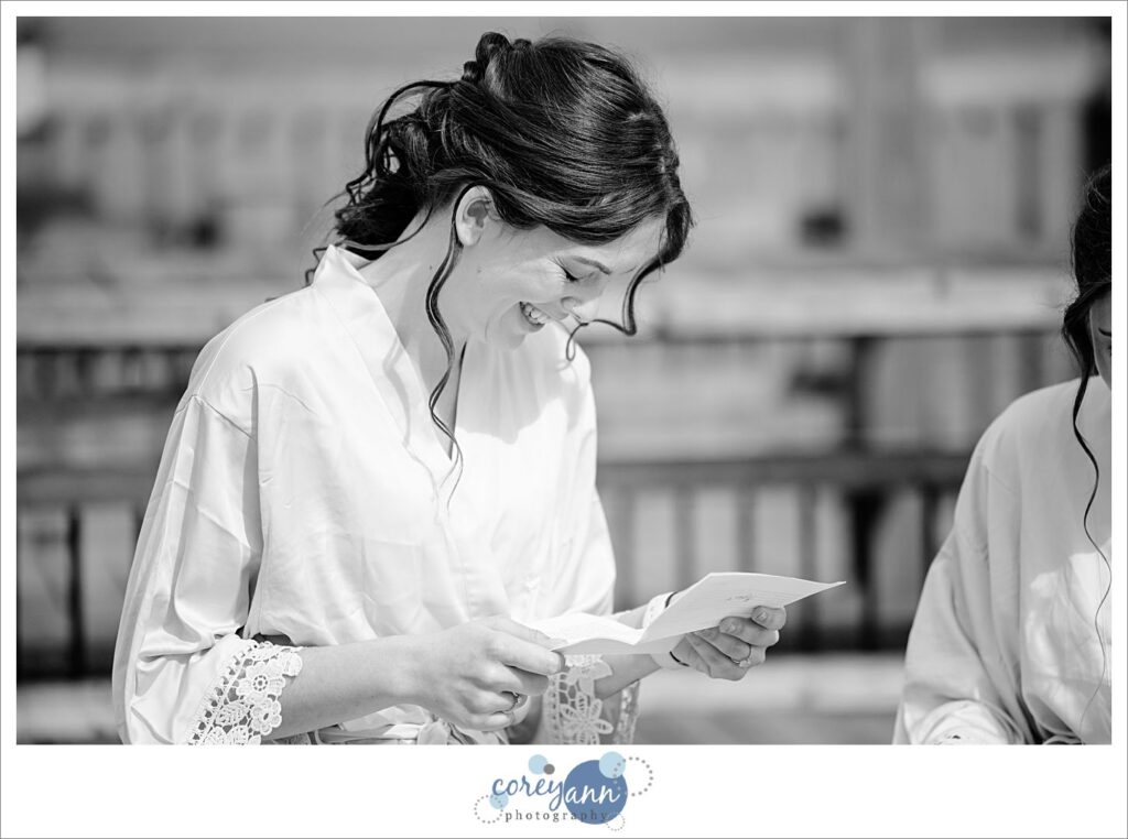 Brides reading letters to one another before wedding in Louisville Ohio