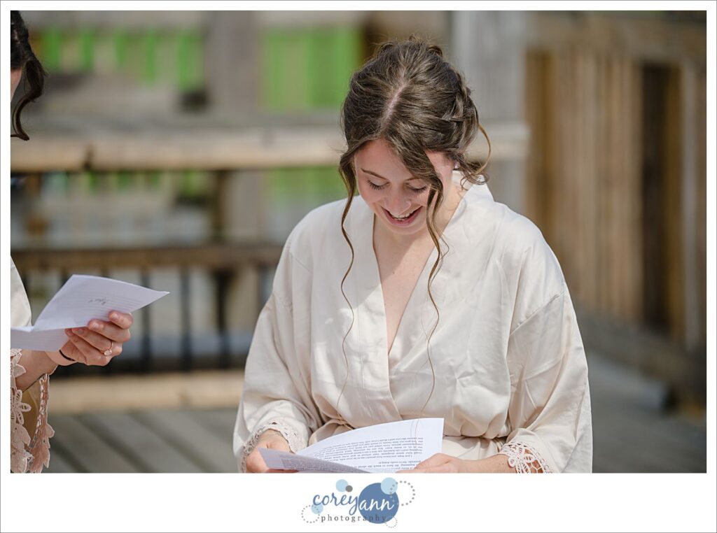 Brides reading letters to one another before wedding in Louisville Ohio