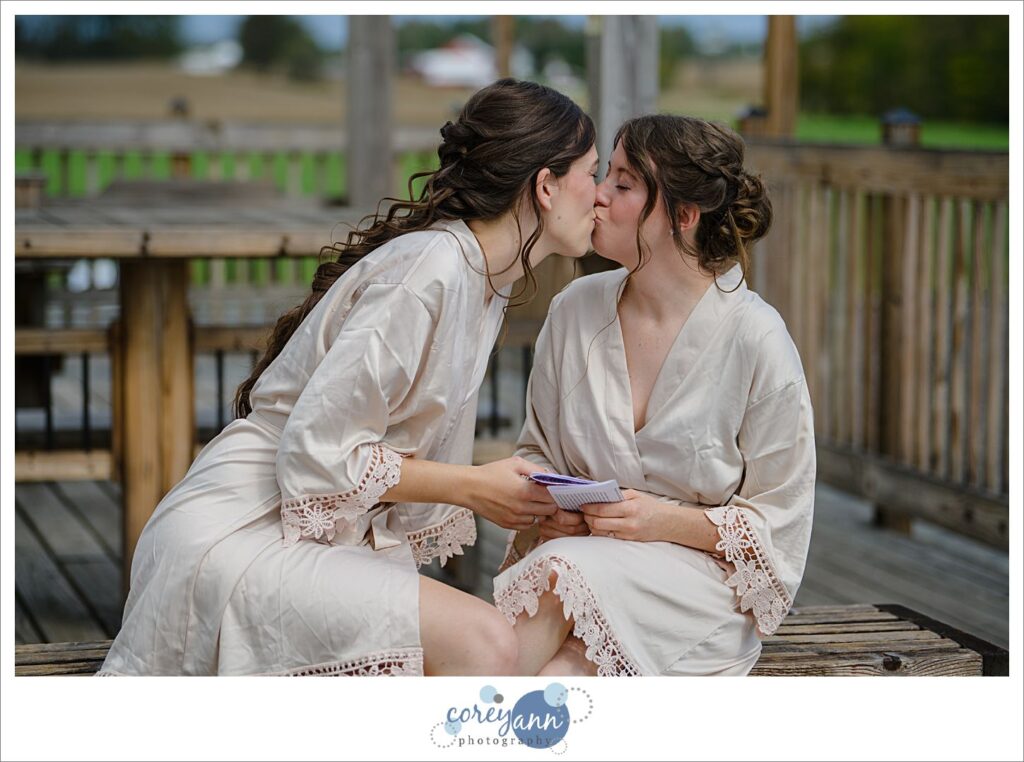 Brides reading letters to one another before wedding in Louisville Ohio