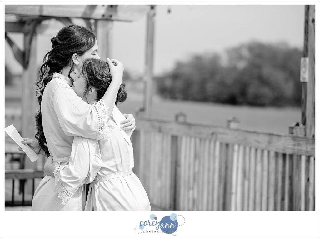 Brides reading letters to one another before wedding in Louisville Ohio