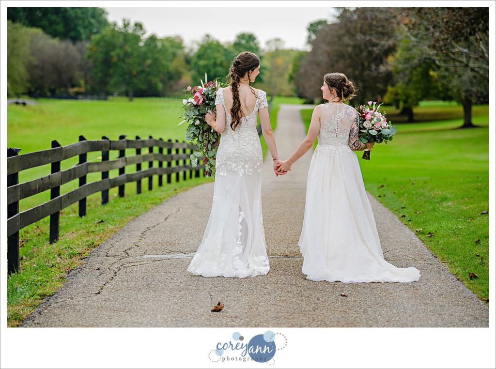 Lesbian couple walking after wedding at Brookside Farm in Ohio