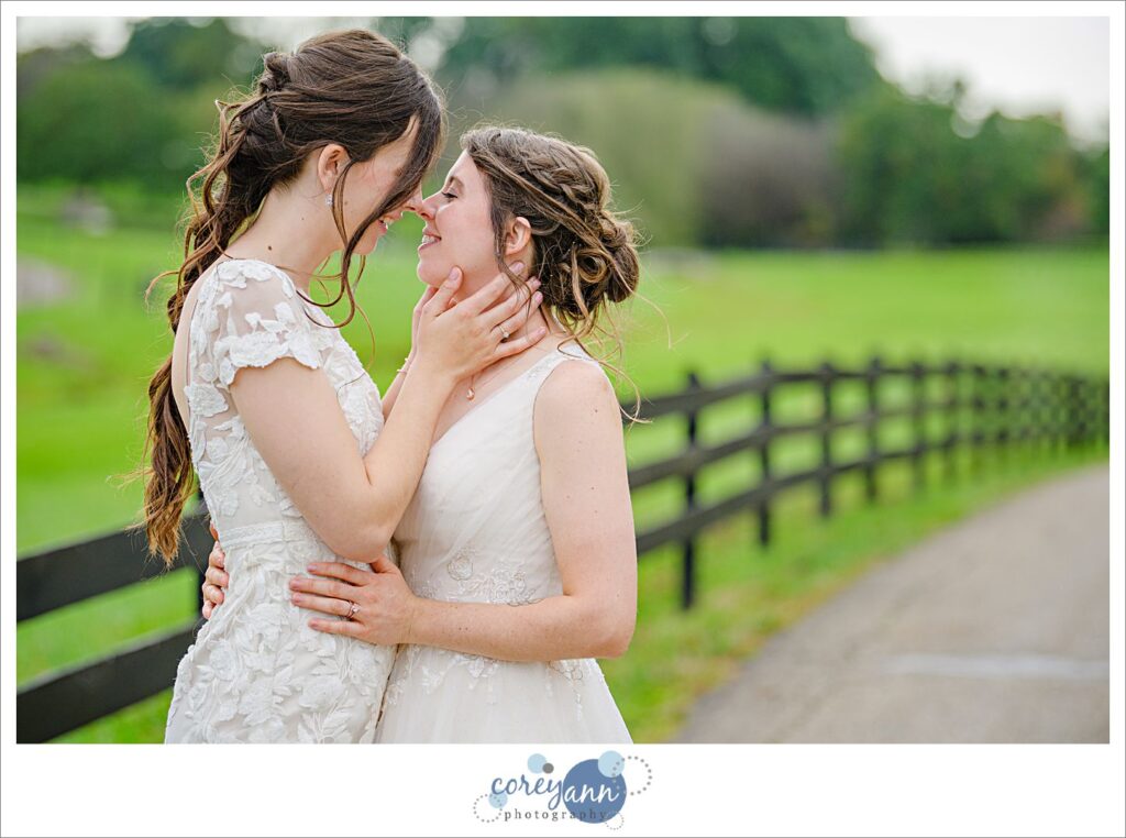 Lesbian couple kissing after wedding at Brookside Farm in Ohio