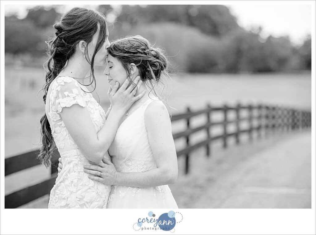 Lesbian couple kissing after wedding at Brookside Farm in Ohio