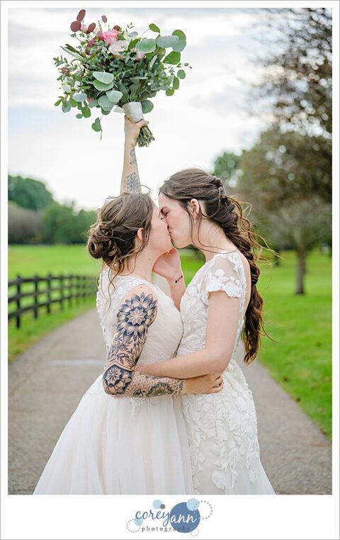 Lesbian couple kissing after wedding at Brookside Farm in Ohio