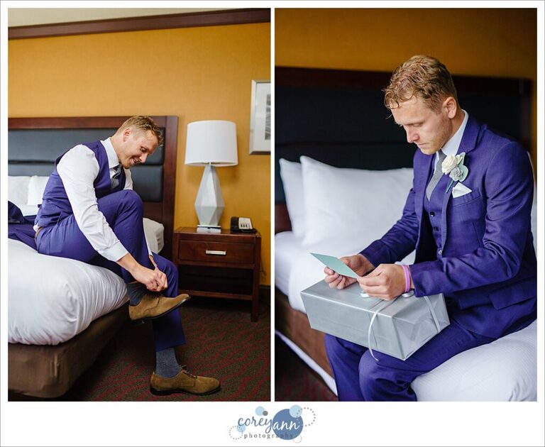 Man in blue suit opening gift from his bride before wedding in Cleveland