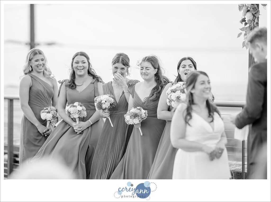 Bridesmaids getting emotional during wedding ceremony at ariel international center