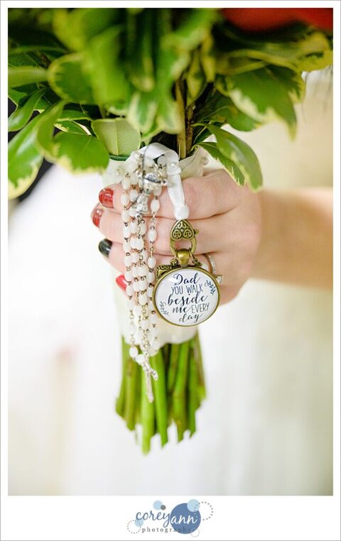 Memorial charm for deceased father on bridal bouquet with rosary