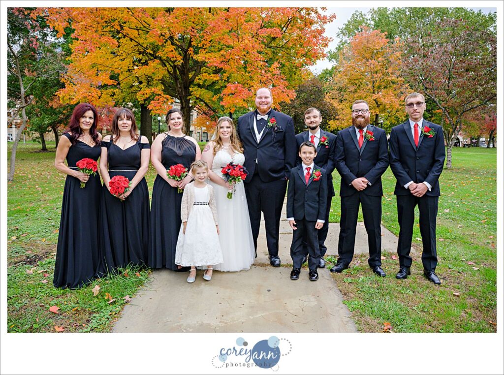 Wedding bridal party photo underneath fall leaves in Warren Ohio