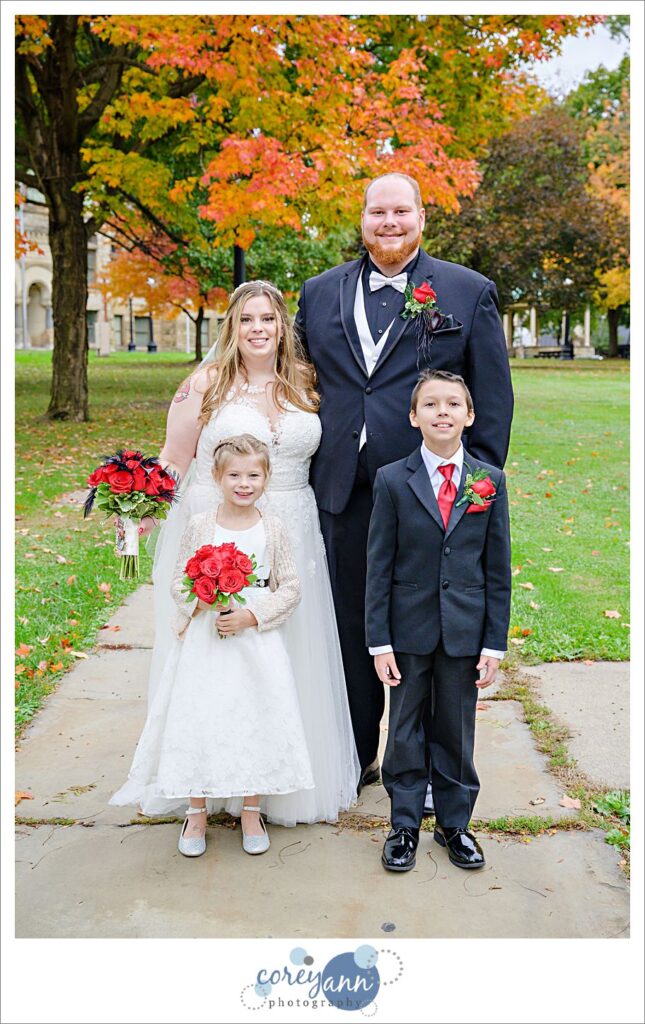 Wedding bridal party photo underneath fall leaves in Warren Ohio