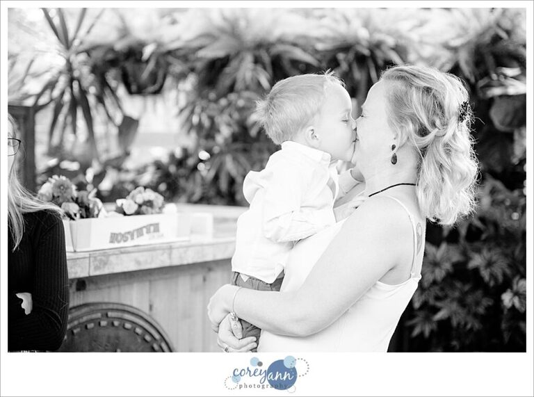 Bride kissing her toddler son before the wedding ceremony at Gervasi Vineyard in Canton Ohio