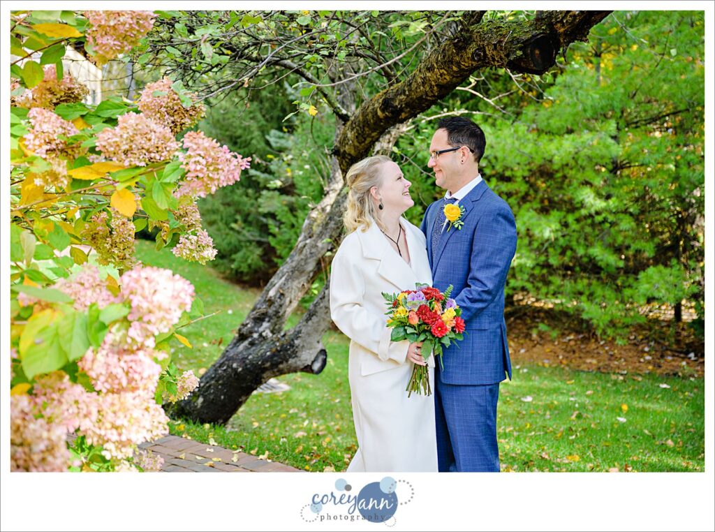 Bride and groom looking at each other and posing after wedding at Gervasi Vineyard in Canton, Ohio.