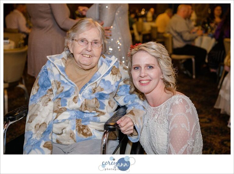 Bride posing with her grandma at wedding reception at Prestwick Country Club