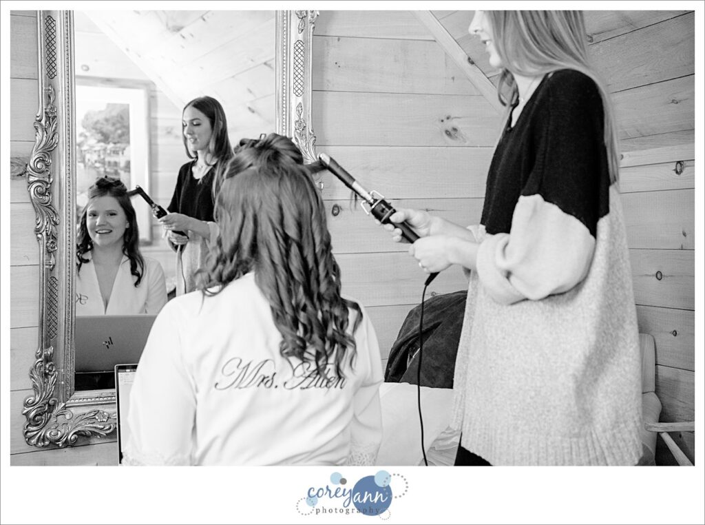 Bride getting her makeup done before wedding at Rivercrest Farm.