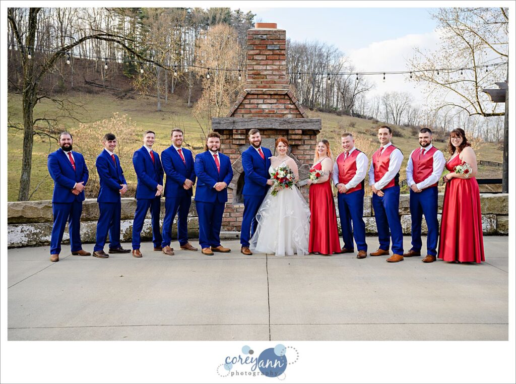 Wedding bridal party in red and blue at Rivercrest Farm in Dover Ohio