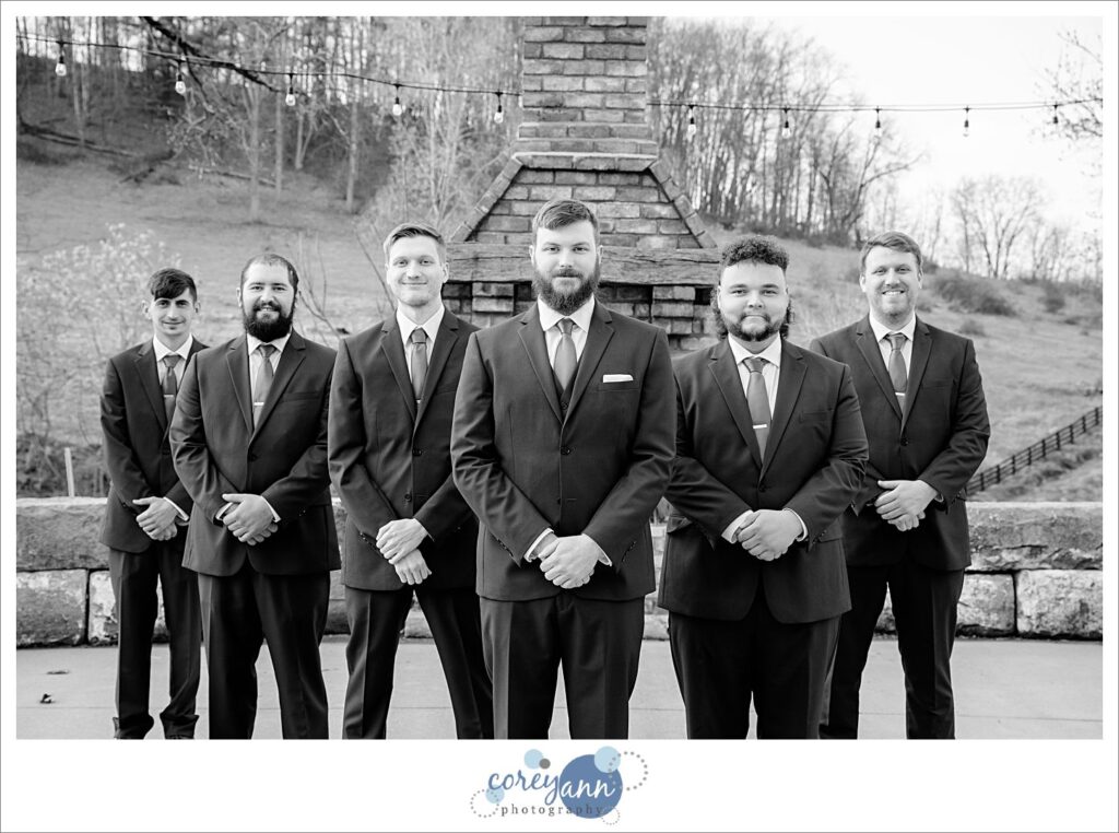 Groom and groomsman in a v pose before wedding
