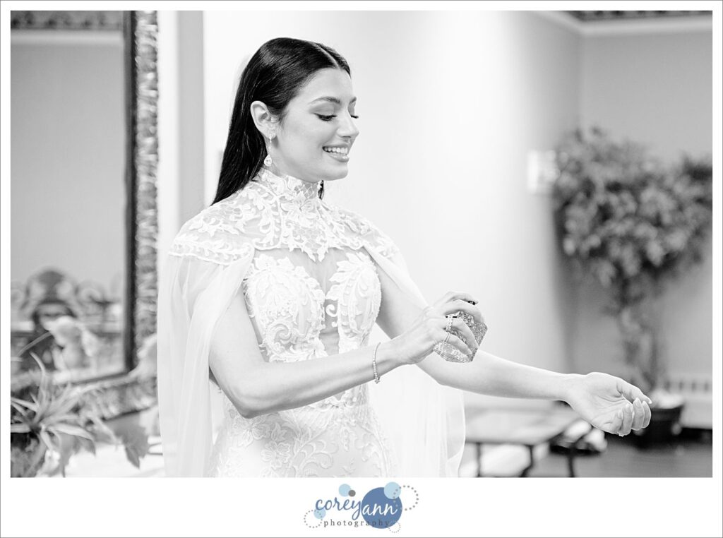 Bride applying perfume to her wrist before wedding ceremony in Canton Ohio