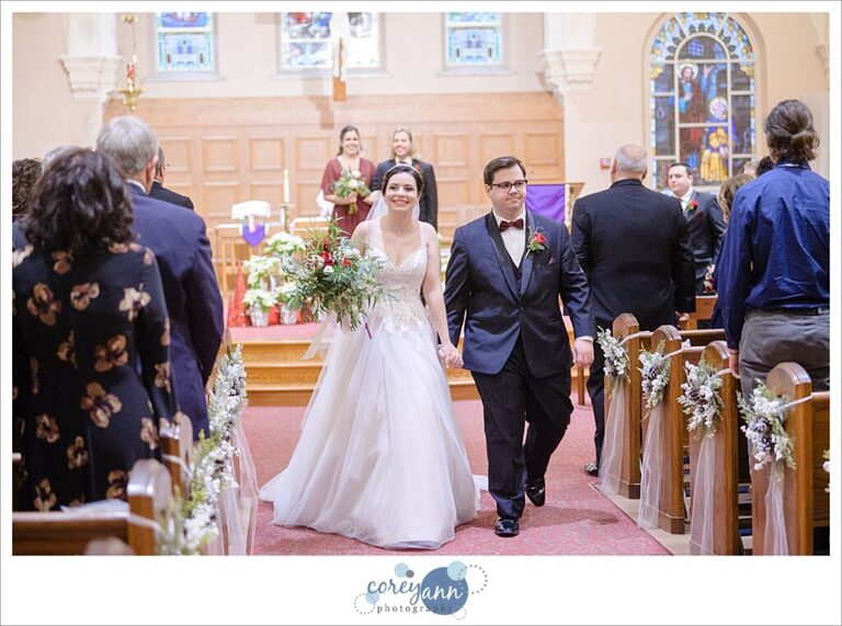 Happy wedding couple after ceremony at St Paul Catholic Church in North Canton