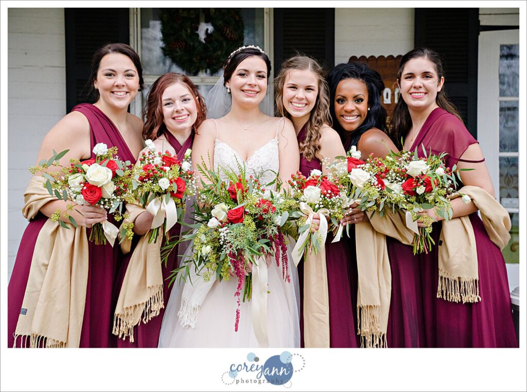 Bride and bridesmaids wearing pashminas for a December Ohio wedding
