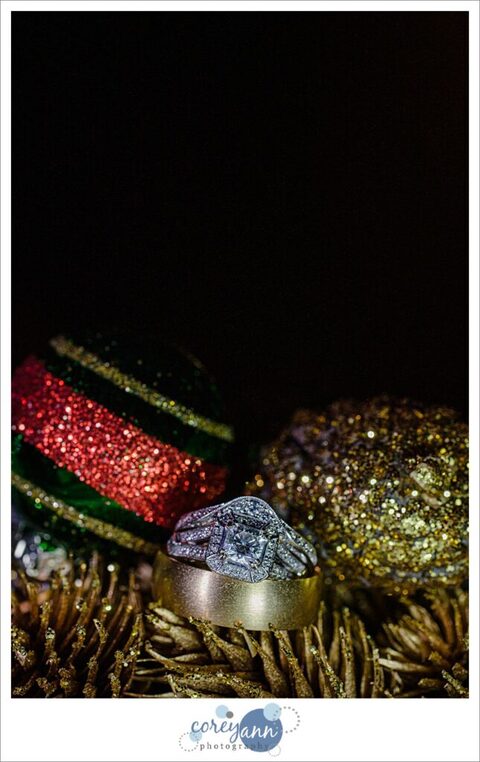 Wedding rings styled with Christmas decorations for a winter wedding