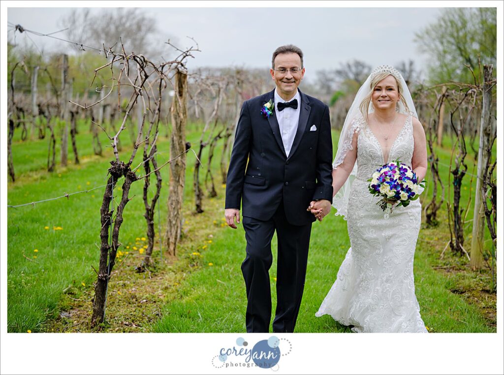 Bride and groom posing in the vineyard at Gervasi in Canton Ohio