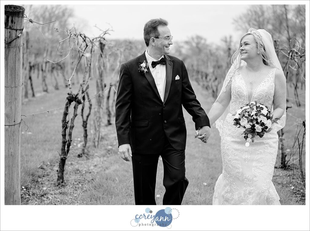 Bride and groom posing in the vineyard at Gervasi in Canton Ohio