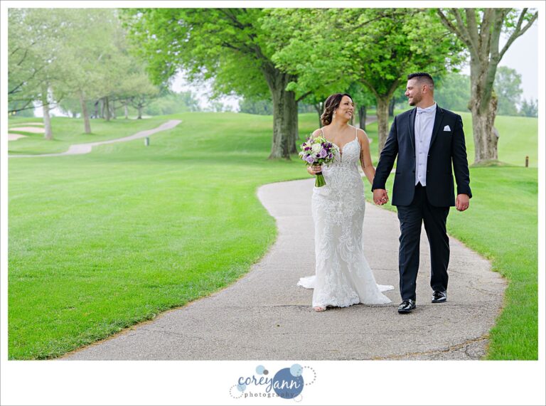 Bride and Groom walking after wedding at Firestone Country Club in Akron Ohio