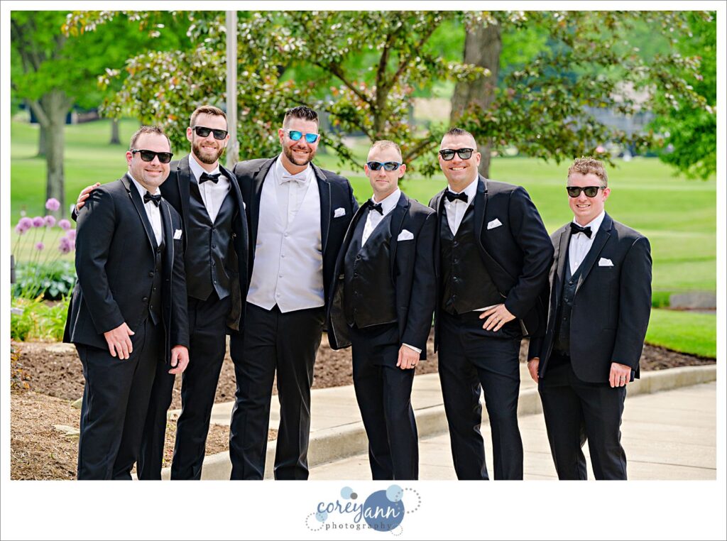 Groom and groomsman in black tuxes at a Firestone Country Club Wedding in Akron Ohio