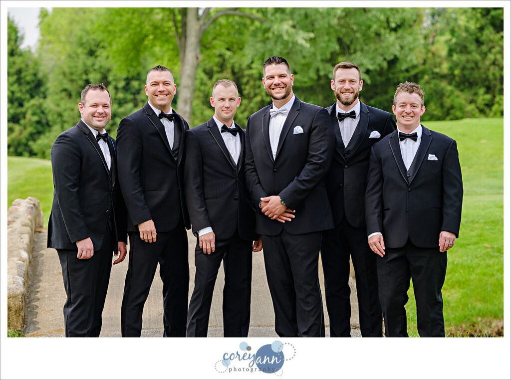 Groom and groomsman in black tuxes at a Firestone Country Club Wedding in Akron Ohio