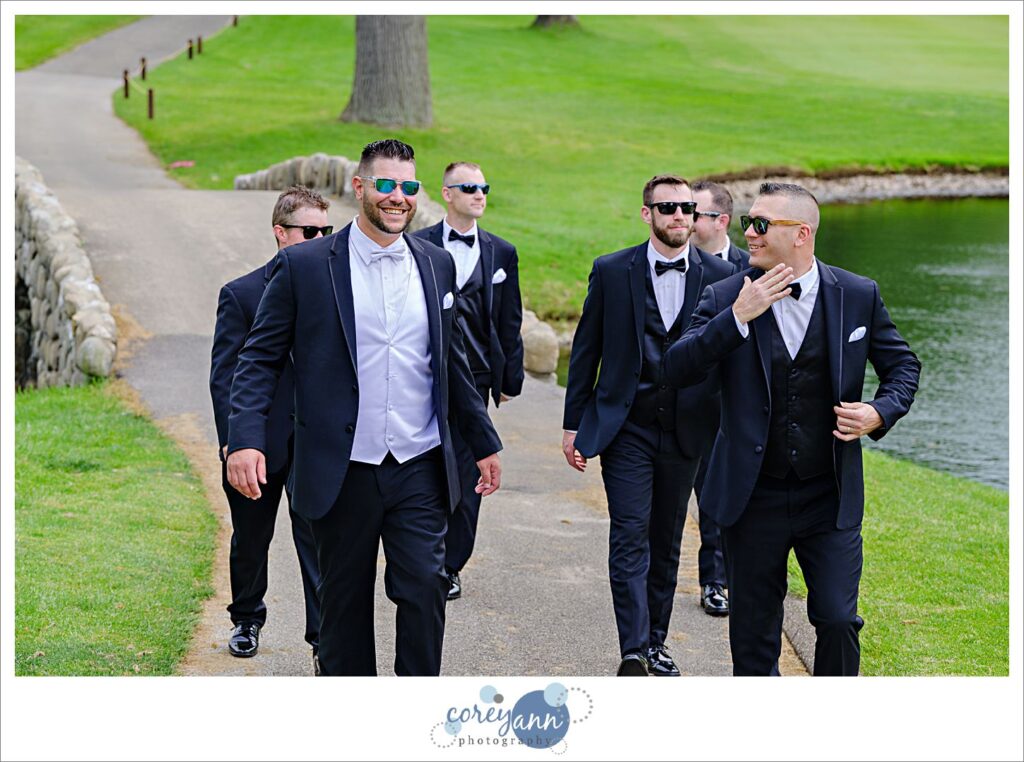 Groom and groomsman in black tuxes at a Firestone Country Club Wedding in Akron Ohio