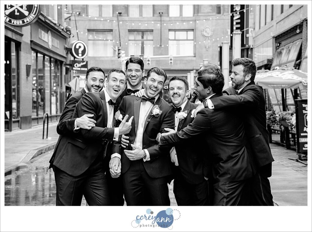 Groom and Groomsman on East 4th Street before wedding in Cleveland