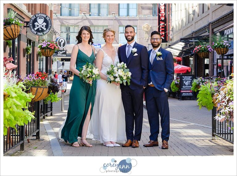 Bridal party posing on a sunny day on East 4th Street in Cleveland