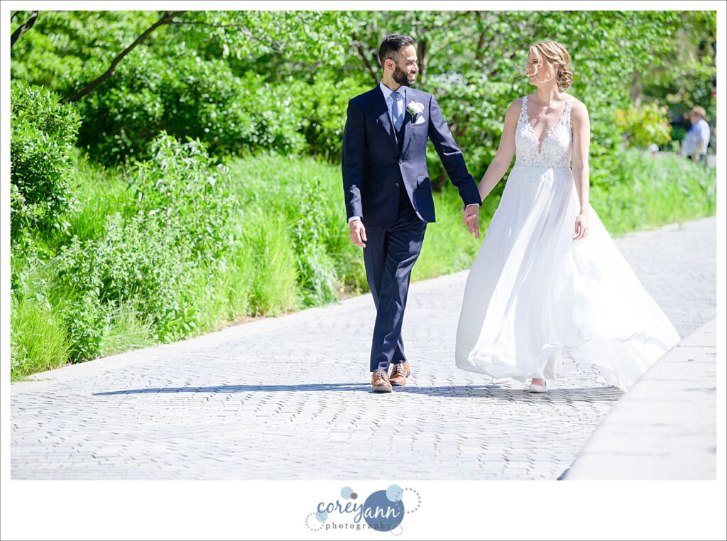 Bride and groom walking in public square in Cleveland Ohio
