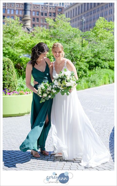 Bride and sister laughing together before wedding in Cleveland