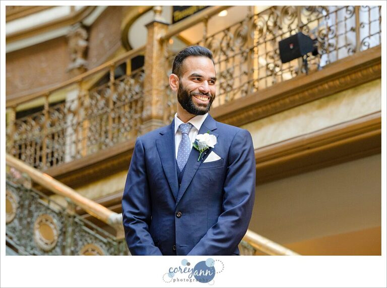 Groom smiling when seeing bride during wedding ceremony at Hyatt Regency Cleveland at The Arcade