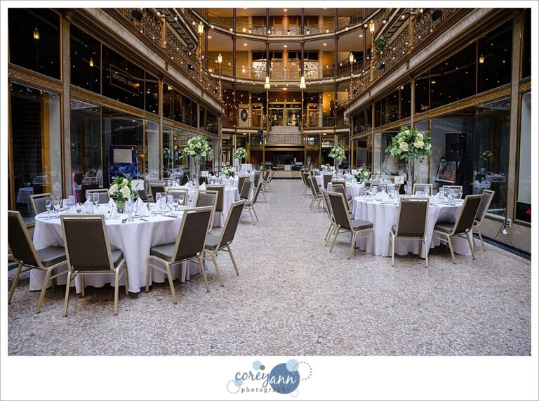 Elegant white and green wedding reception decor at Hyatt Regency Cleveland at The Arcade 