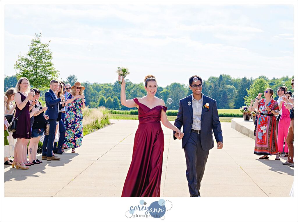 Outdoor wedding ceremony in the garden at Hawken Upper School in Gates Mills, Ohio