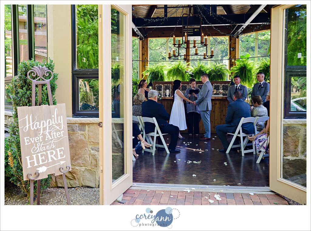 Wedding ceremony at Gervasi Vineyard in the conservatory in Canton Ohio