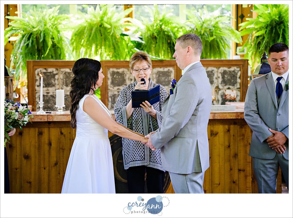 Wedding ceremony at Gervasi Vineyard in the conservatory in Canton Ohio