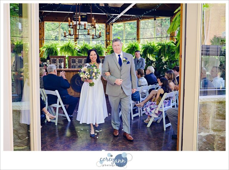 Wedding ceremony at Gervasi Vineyard in the conservatory in Canton Ohio