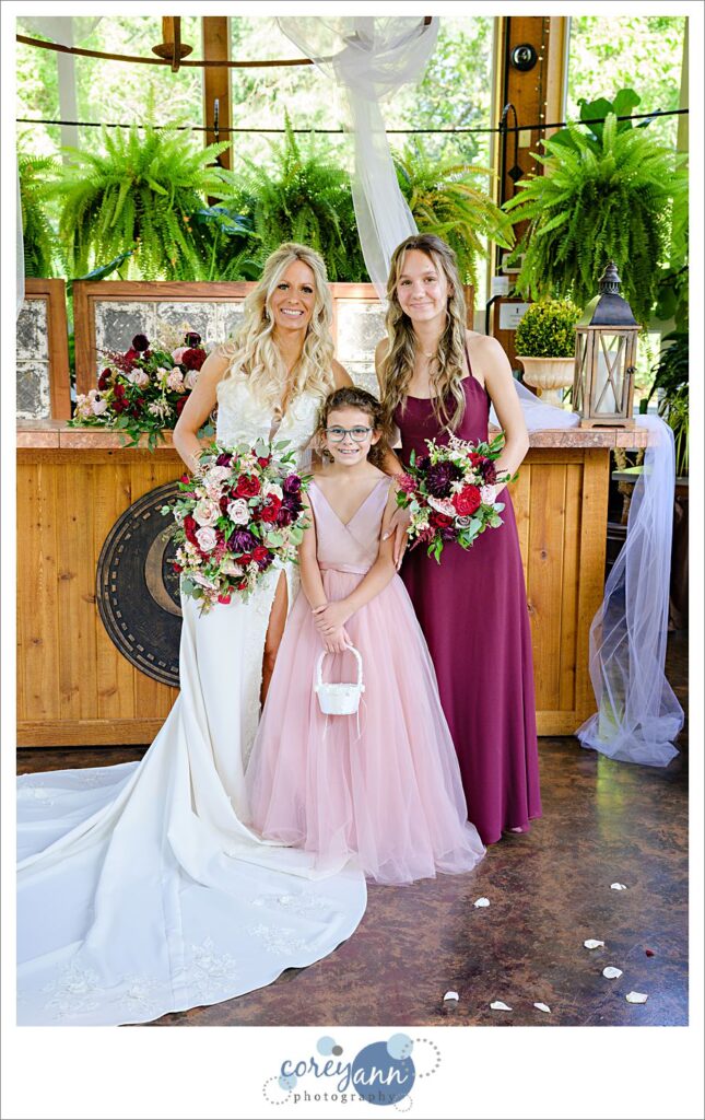 Family posing for a portrait with the bride and groom after their wedding ceremony at Gervasi