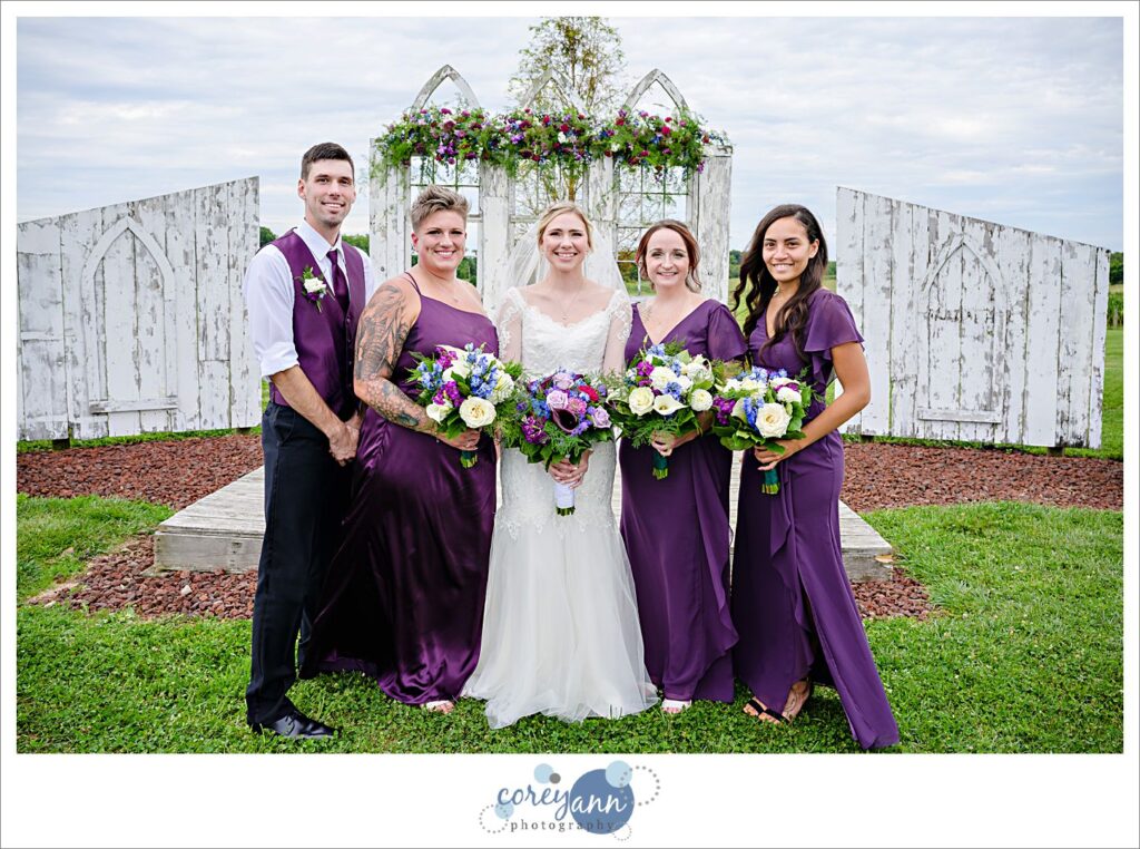 Bride and bridesmaids wearing long purple gowns at Nickajack Farms